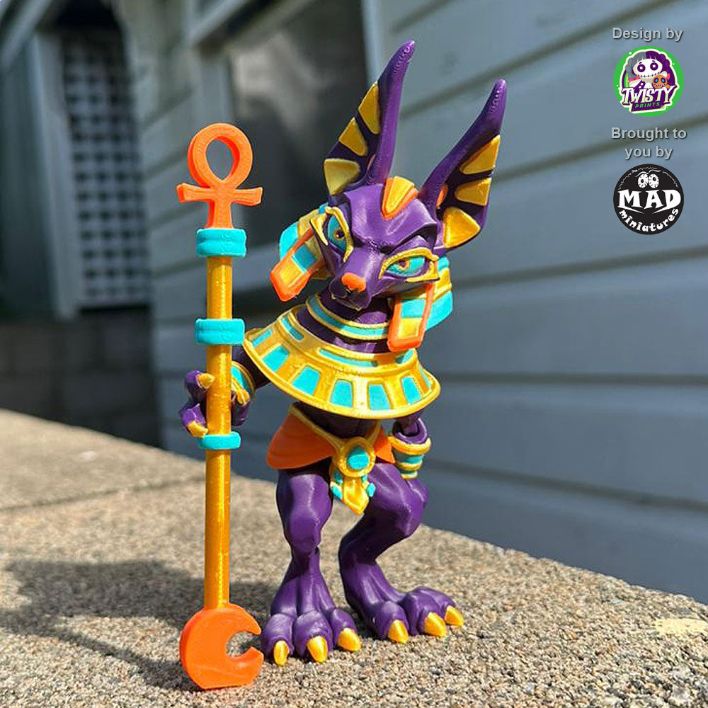 Articulated Anubis figure with staff, staring directly at the viewer