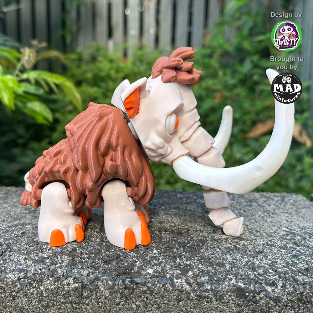 Side view of the Articulated Mammoth, highlighting its unique appearance with its mismatched tusks, wiggly tail, and playful design.