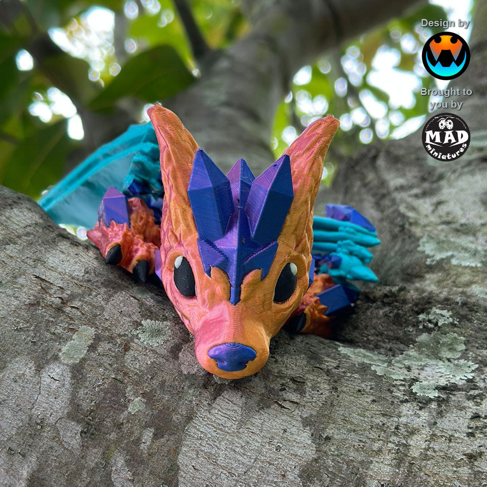 Baby Crystal Wolf Dragon with a cute expression, perched on a tree. Its shimmering body and turquoise wings create a stunning contrast.