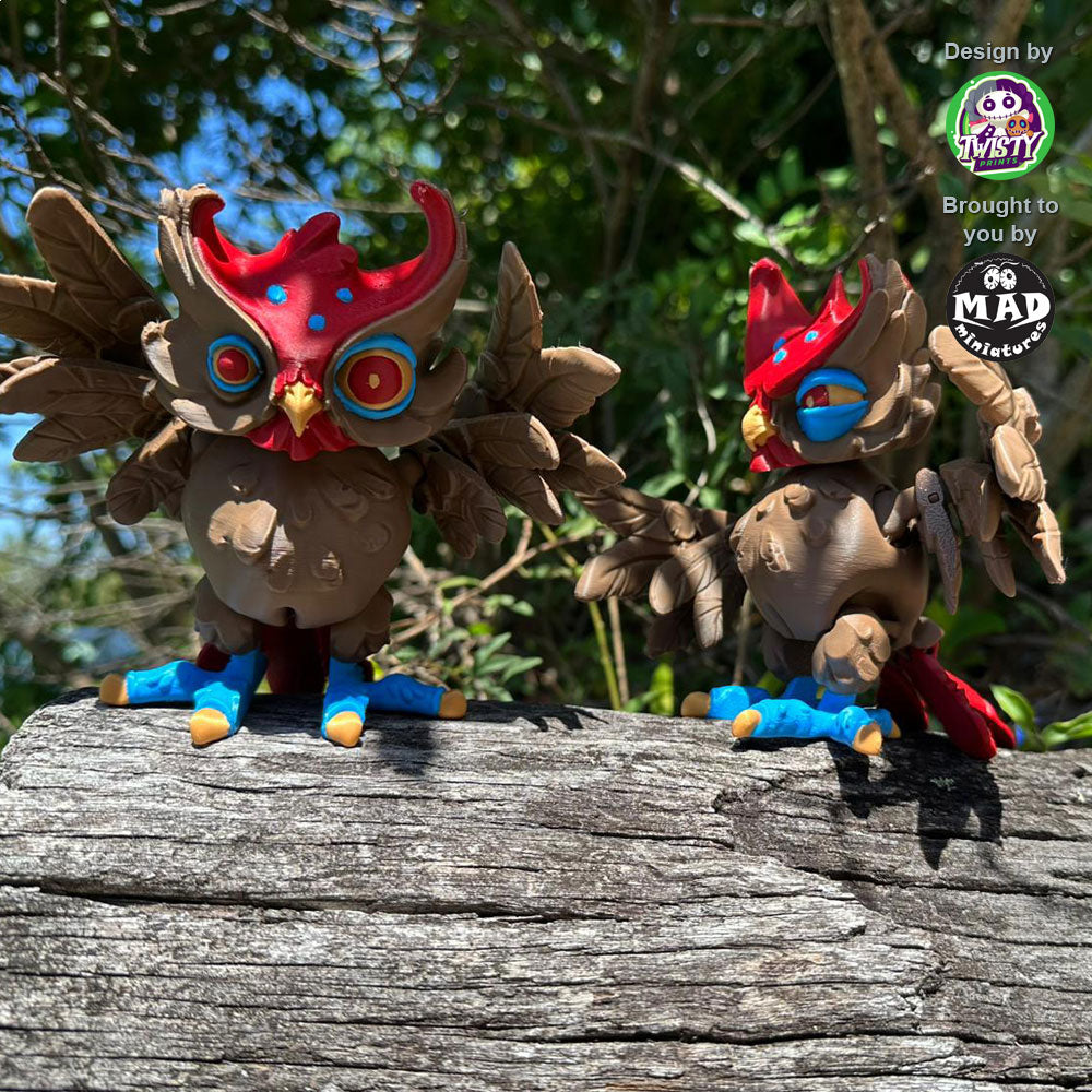 Two Creepy Owls (hypnotic and skeptical versions) perched on a fallen tree, staring at the viewer with movable wings and heads.