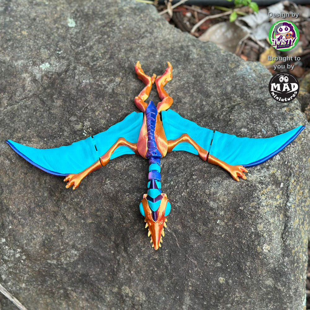 Top and front view of the Creepy Pterosaurus with its articulated wings, created by Mad Miniatures