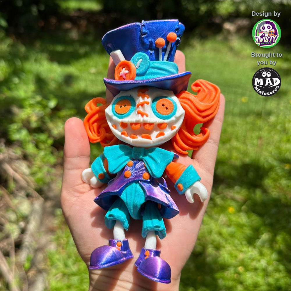 Mad Hatter held in a person's hand, highlighting his quirky charm, made by Mad Miniatures.
