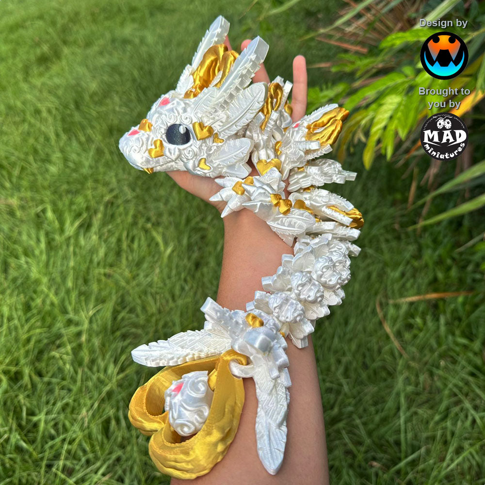 Baby Light Heart Dragon - a shimmering white 3D-printed dragon with golden details, pink hearts, and delicate feathers, perfect for Valentine's Day.