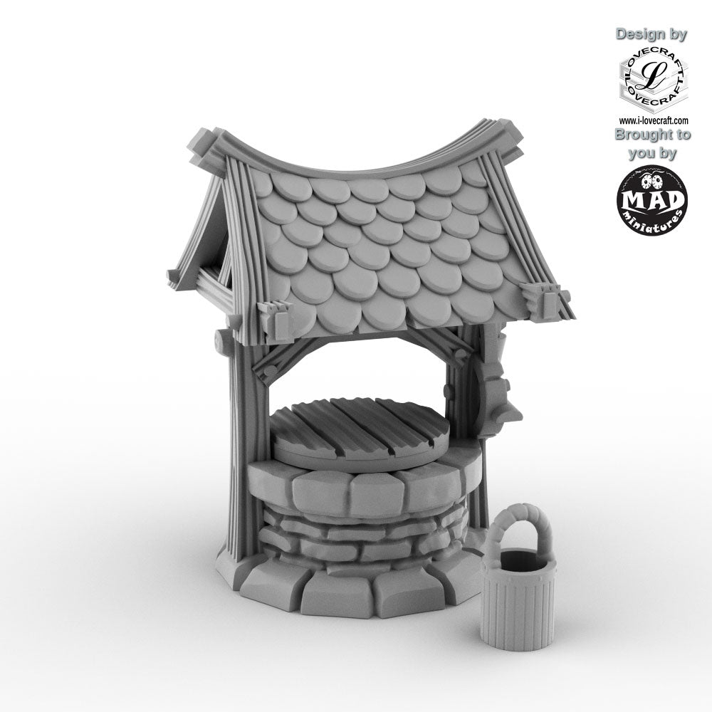 Rustic little fantasy well with shingled roof and bucket by Mad Miniatures