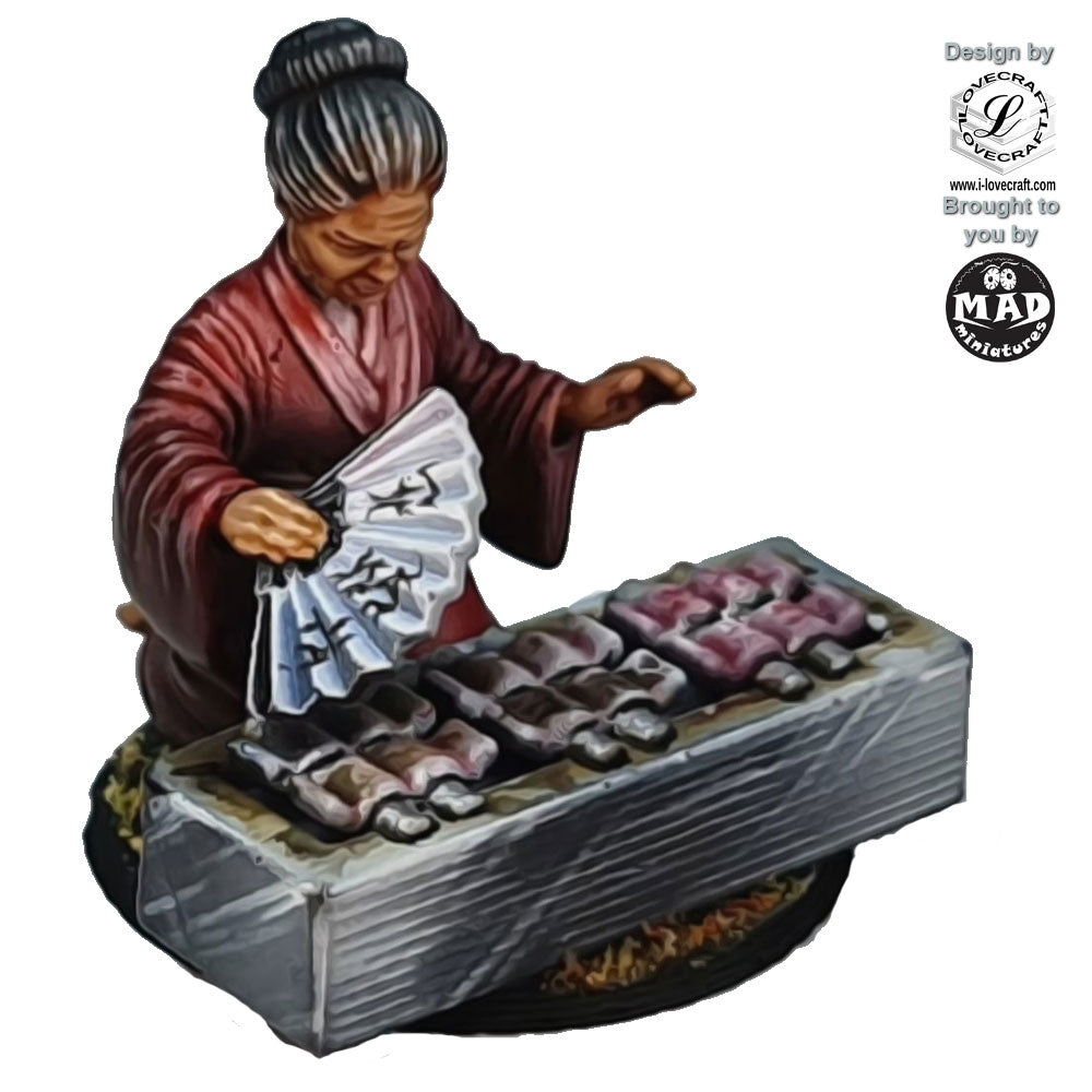 28mm miniature of an Edo-period woman grilling fish at a market stall, wearing a kimono and waving a fan, designed for tabletop gaming and dioramas.