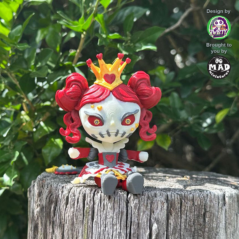 Queen of Hearts articulated figure sitting on a wooden post, featuring red curls, a golden crown, and a gothic fairytale design.
