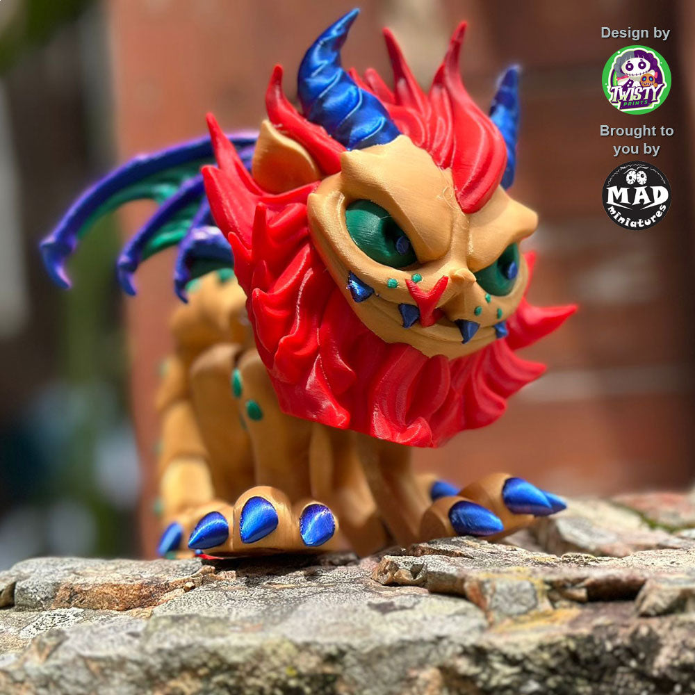 Manticore perched on a rock, showcasing her powerful presence with piercing green eyes, fiery red mane, and shimmering blue horns, exuding a fearsome majesty