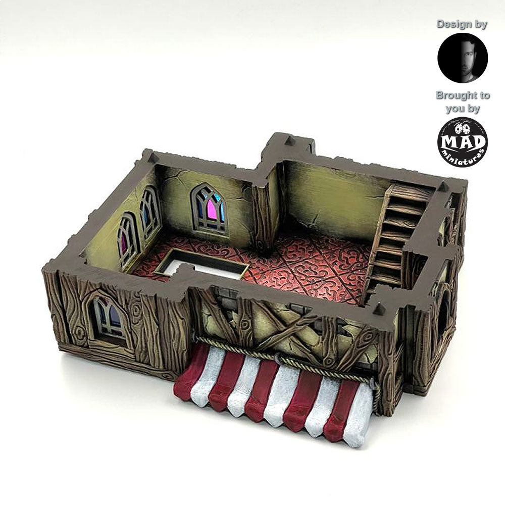 Fully painted bottom floor of the Merchant's House tabletop terrain, showcasing a medieval shop space with a counter and detailed interior