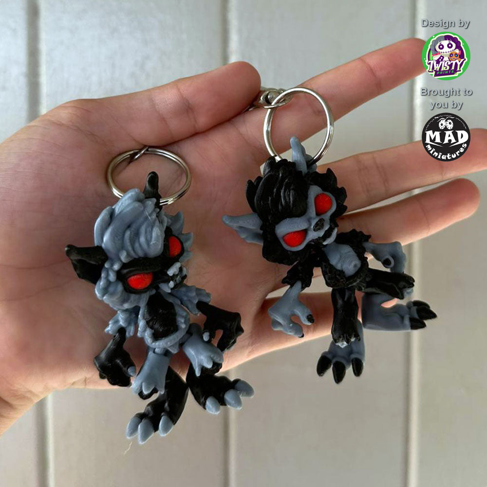 Mini Werewolf keychain, fully articulated with grey and black fur, piercing blood-red eyes, designed by Twisty Prints and made by Mad Miniatures.