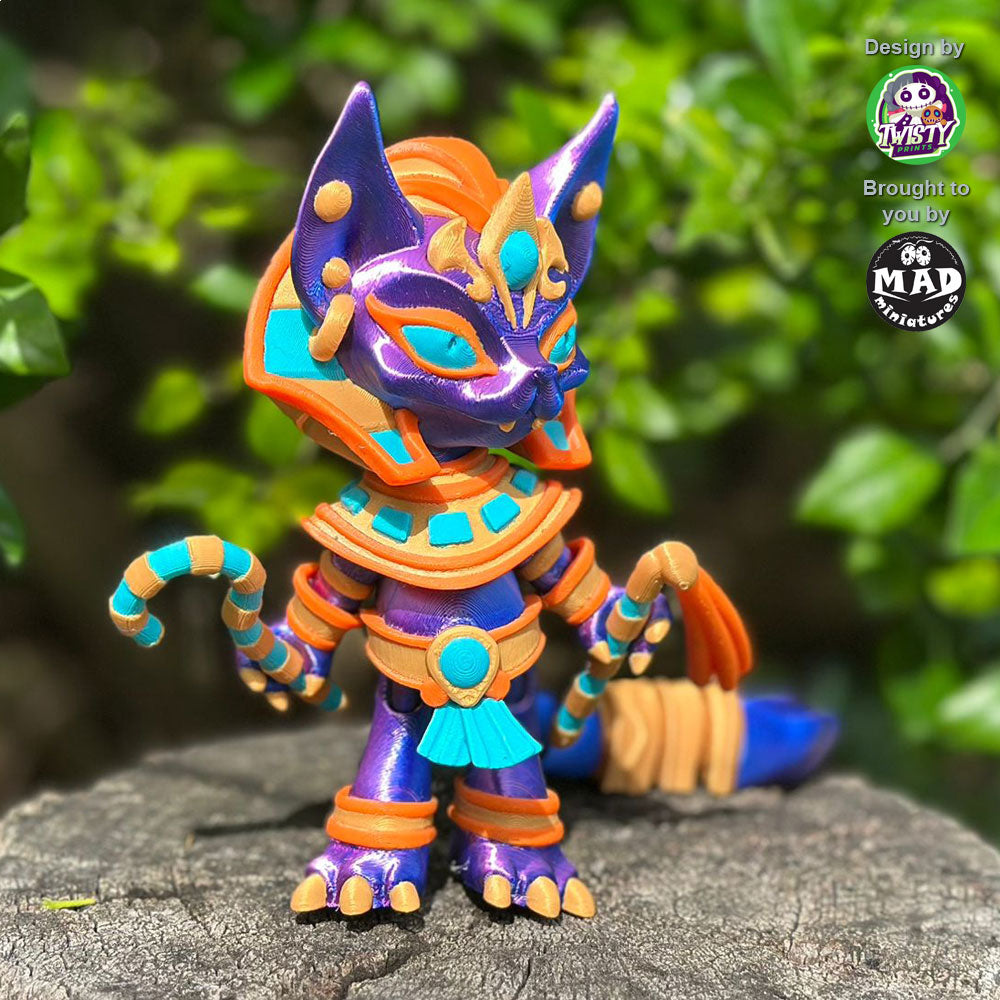 Pharaoh Cat standing on a tree trunk, looking sideways, highlighting her shimmering blue-purple coat and intricate Egyptian details.