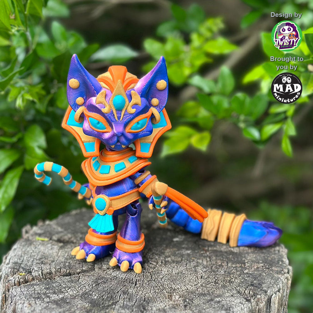 Pharaoh Cat standing on a tree trunk, holding her Egyptian ceremonial staff, with a shimmering blue-purple coat and golden accessories.