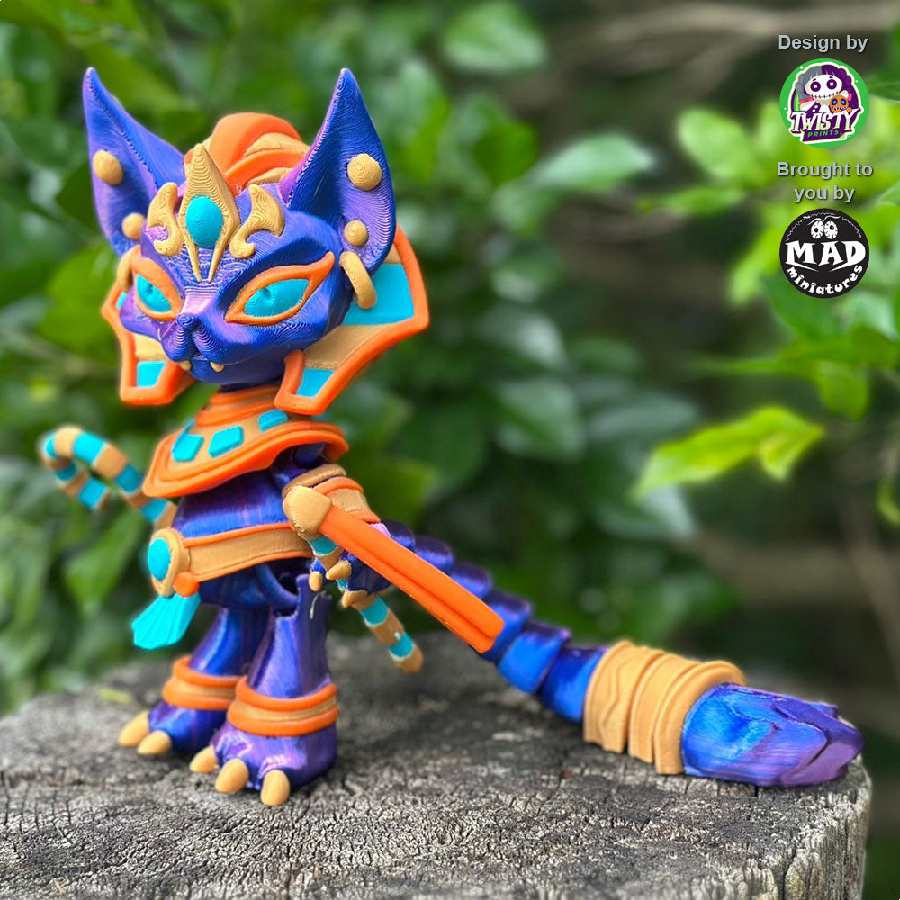 Pharaoh Cat from the side, showcasing her massive tail, shimmering coat, and vibrant golden, orange, and turquoise Egyptian attire.