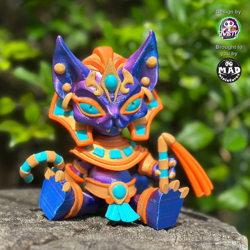 Pharaoh Cat sitting gracefully with all her golden Egyptian accessories, ceremonial staff, and massive shimmering tail.
