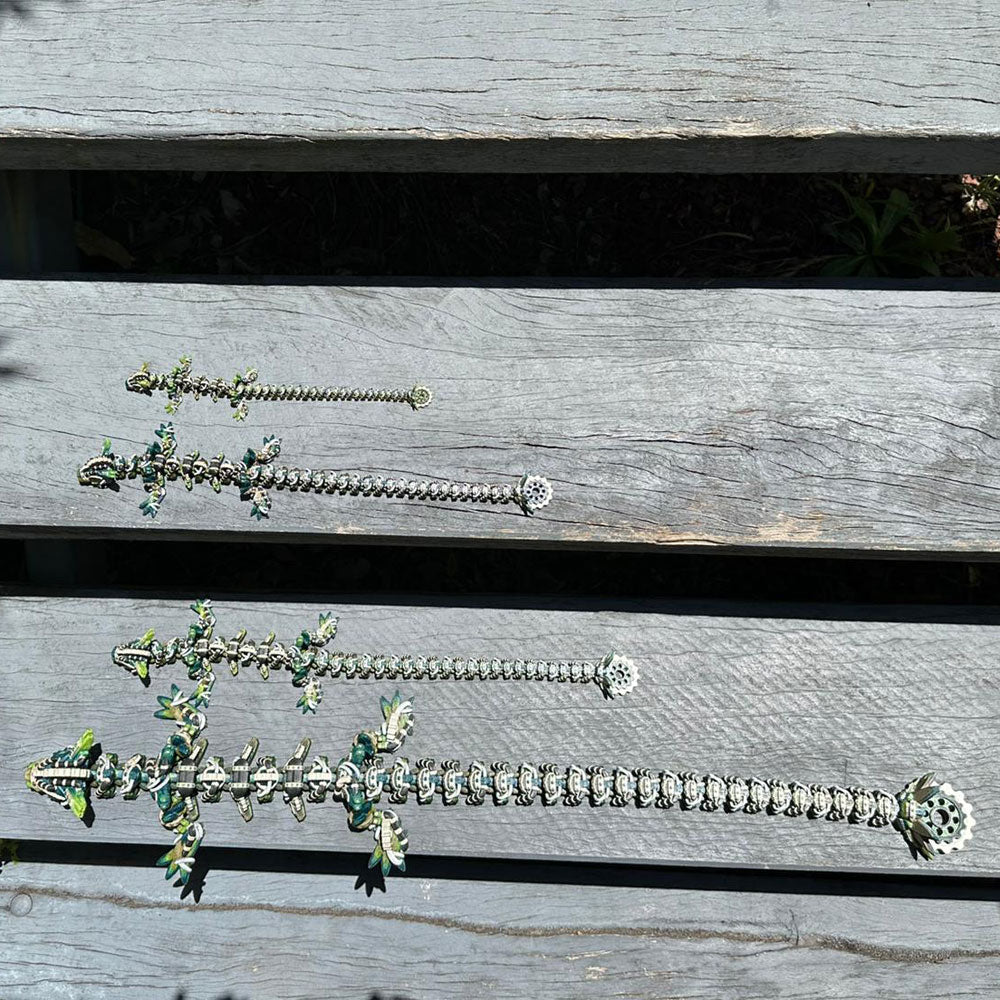 Length comparison of all four sizes of the articulated steampunk dragon in natural green, brown, and metallic colors