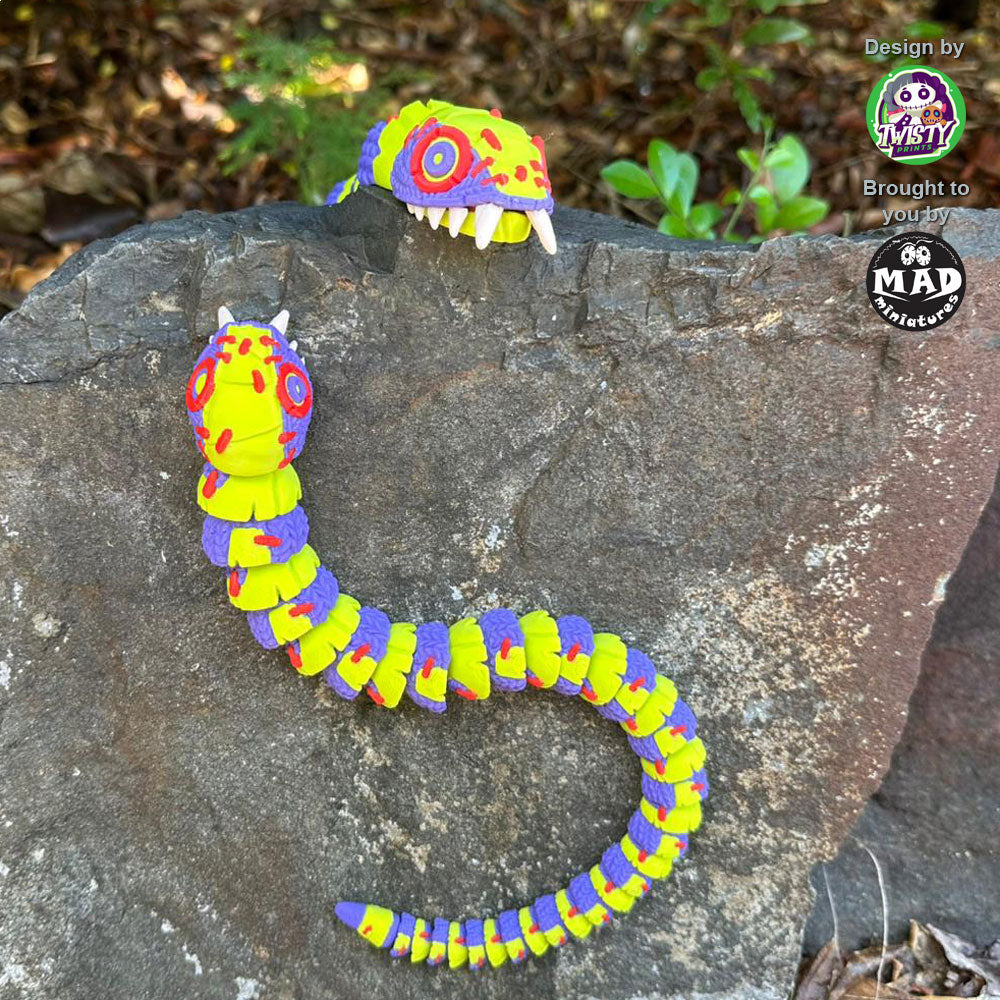 Both sizes of Stuffed Snake rock climbing, emphasizing their articulated design and quirky, colorful appearance in action.