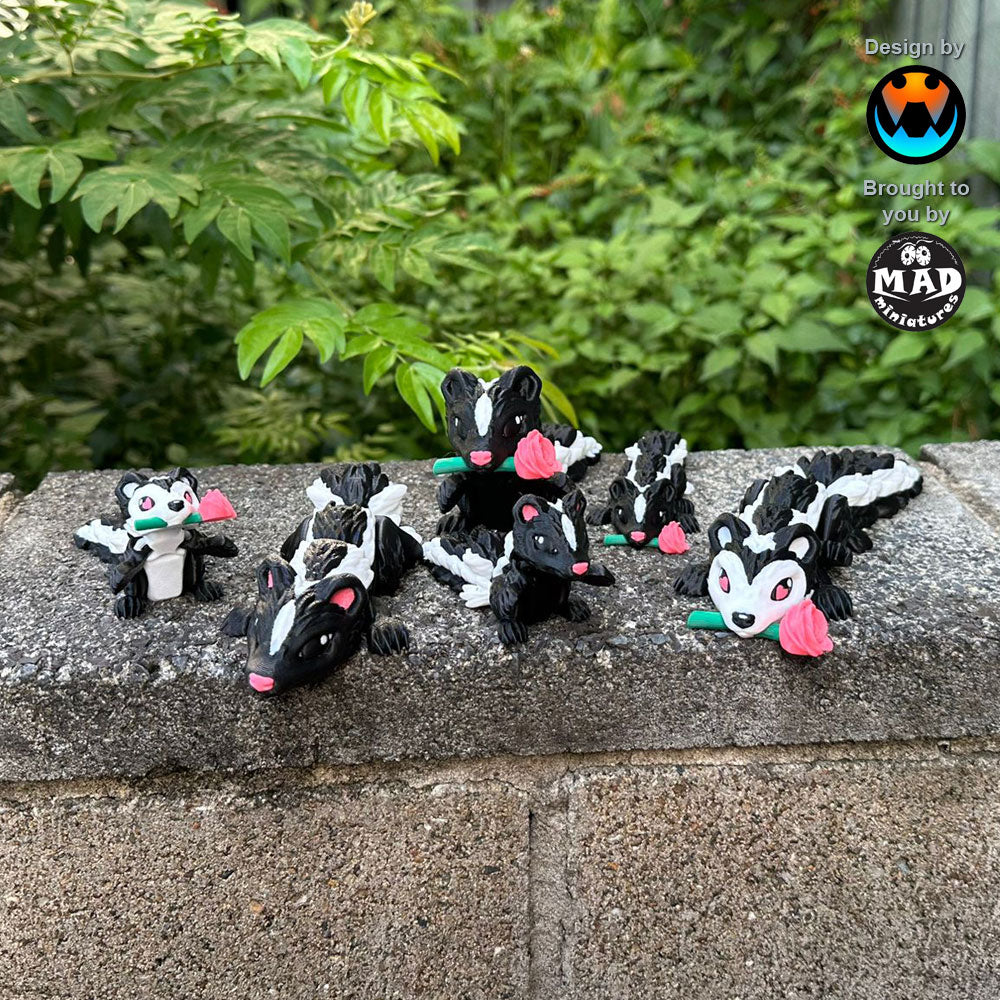 Pink Sweetheart Skunks from Mad Miniatures, designed by Cinderwing, on a wall, showcasing all six versions with and without roses, in small and normal sizes.