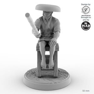 Fisher sitting on stool