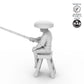 Fisher sitting on stool