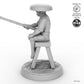 Fisher sitting on stool