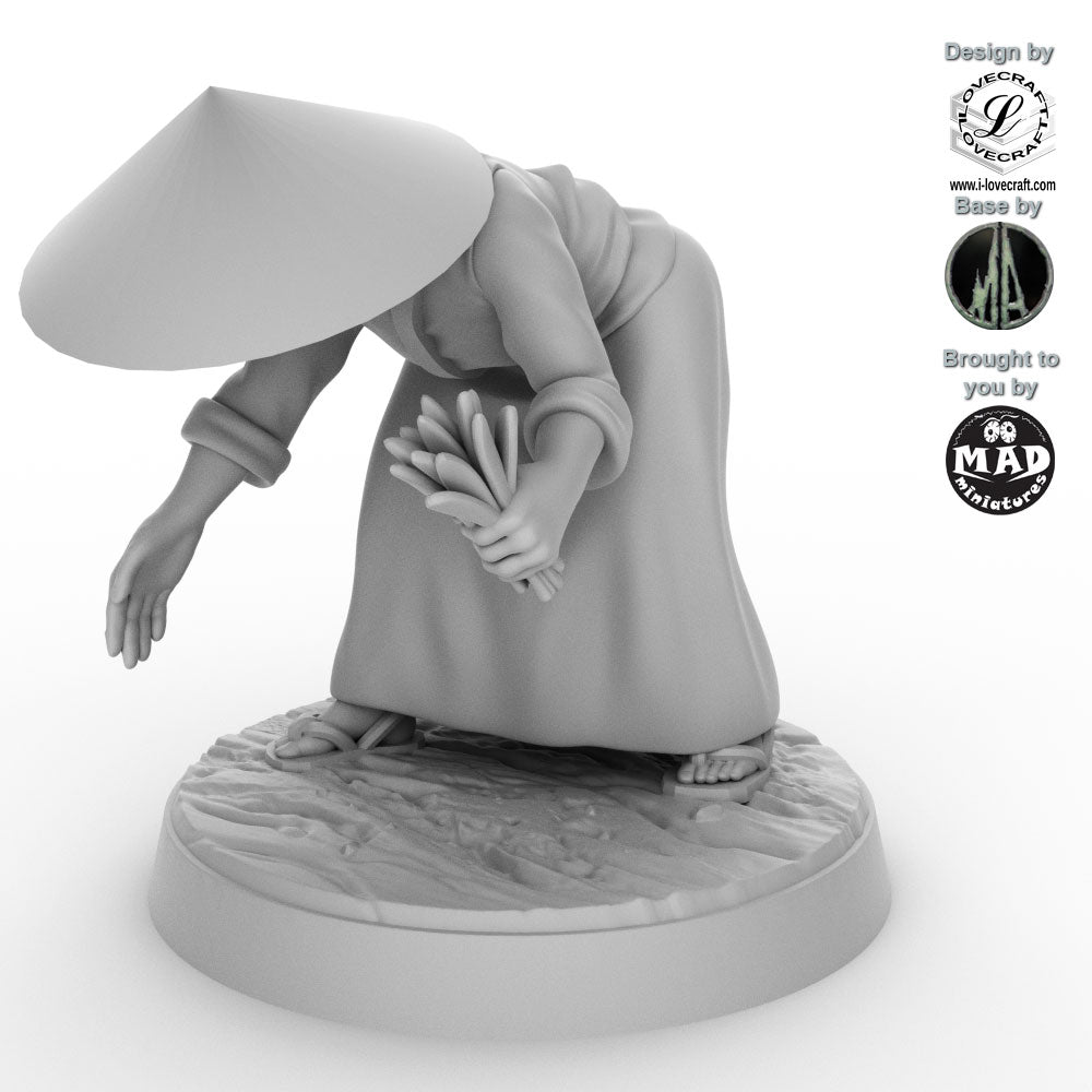 Field Worker with Rice Sheaf