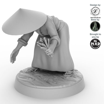 Field Worker with Rice Sheaf