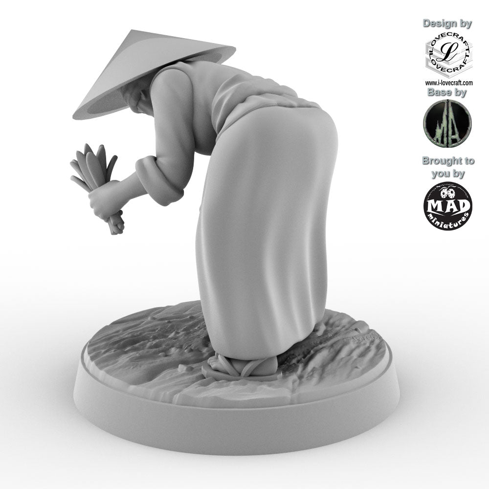 Field Worker with Rice Sheaf