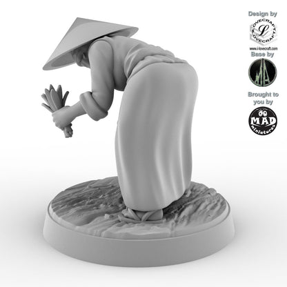 Field Worker with Rice Sheaf