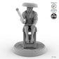 Fisher sitting on stool