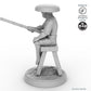 Fisher sitting on stool