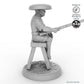 Fisher sitting on stool