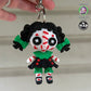 Close-up of the Creepy Doll Keychain from Mad Miniatures, designed by Twisty Prints. Featuring detailed facial expressions and a creepy yet charming look, this keychain is a must-have collectible.