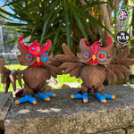 Two Creepy Owls (hypnotic and skeptical versions) sitting on a wall, staring directly at the viewer with their articulated wings and heads