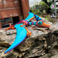 Creepy Pterosaurus lying on a rock, designed by Twisty Prints, staring with one big eye
