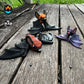 Articulated Tiny Bat in three versions: dark red with black wings, orange with black wings, and sparkly dark purple with pink ears. Fully articulated and poseable.