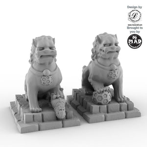 Foo Dogs statues from Nippon Saga by Mad Miniatures and Iain Lovecraft, detailed tabletop guardian miniatures.