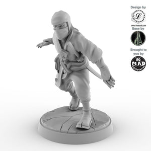 The Silent Blade from Nippon Saga - 28 mm ninja miniature designed by Iain Lovecraft, captured mid-kick in a dynamic martial pose, made by Mad Miniatures.