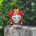 Queen of Hearts articulated figure sitting on a wooden post, featuring red curls, a golden crown, and a gothic fairytale design.