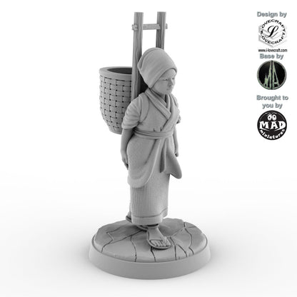 32 mm miniature of a Japanese field worker carrying a woven basket – Nippon Saga model by Mad Miniatures.