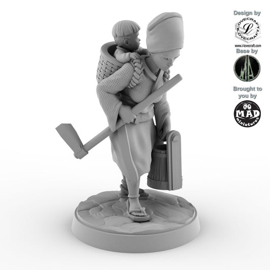 32 mm miniature of a Japanese woman carrying a baby in a basket while holding a hoe and bucket – Nippon Saga model by Mad Miniatures.