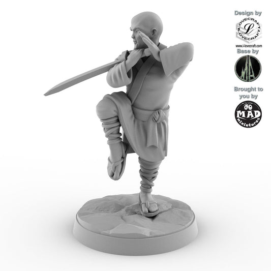 Shaolin Monk miniature with raised sword in a crane stance, designed by Iain Lovecraft and made by Mad Miniatures