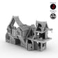 Ruined Warehouse terrain piece from the Helwick campaign. A detailed medieval-style structure with damage and a crane, designed by Terrablocks and made by Mad Miniatures.
